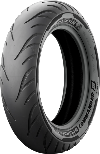 Rear Michelin Commander III motorcycle tire in 130/90B16 size with 73H load index, featuring deep tread pattern and sidewall branding.