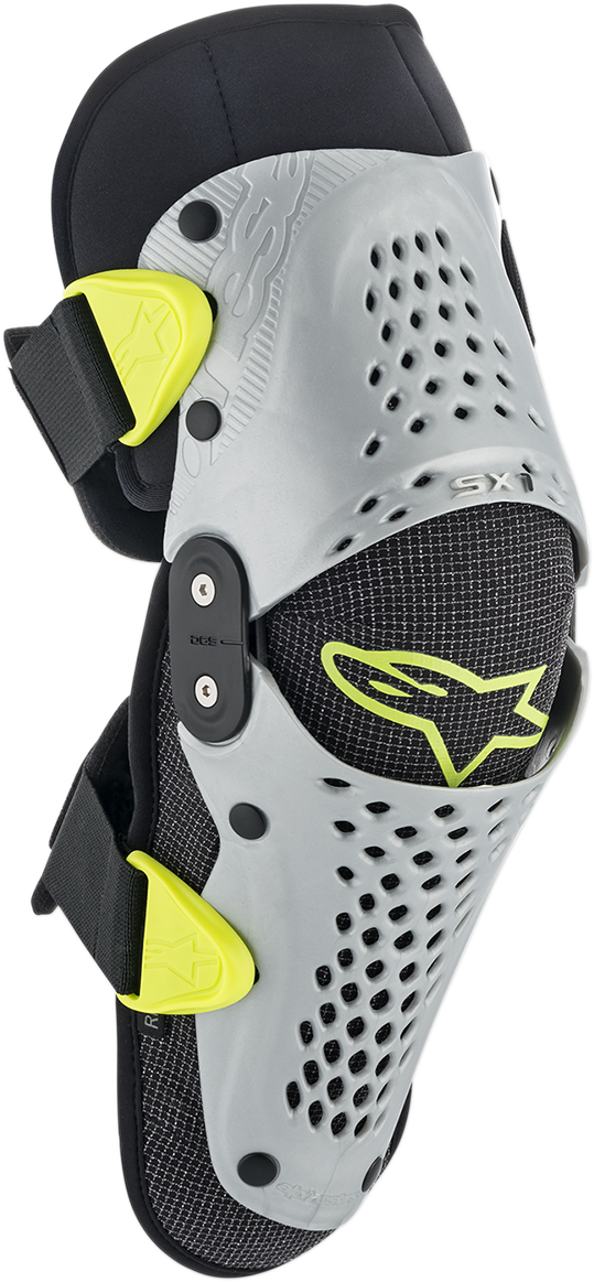 Alpinestars Youth SX-1 knee protectors in silver and yellow fluo, S/M size, designed for motorcycle protective gear.