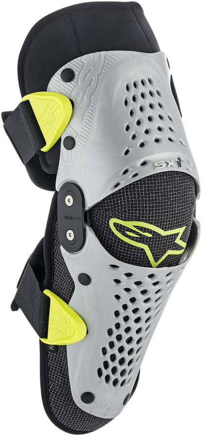 Alpinestars Youth SX-1 knee protectors in silver and yellow fluo, S/M size, designed for motorcycle protective gear.