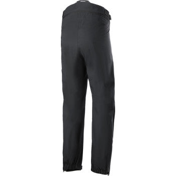 Black Alpinestars AMT Storm Gear Drystar XF Pants in 3XL with reinforced knee panels and adjustable waist for motorcycle riding.