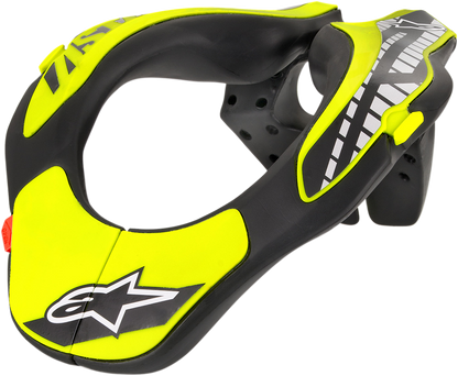 Alpinestars youth neck support in black and yellow fluo, designed for helmet safety, shown on a plain background.