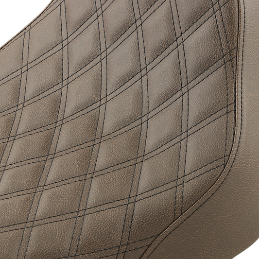 Brown SADDLEMEN Renegade Solo Seat with lattice stitching for Harley FLST bikes, designed by Bill's Exhausts.