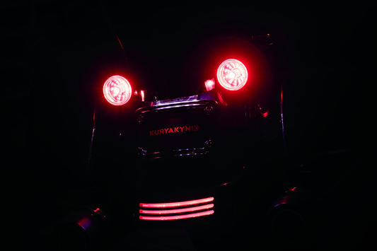 Kuryakyn 1157 Red/Red LED bulb for powersports dual function replacement showing the red LED light and bulb base