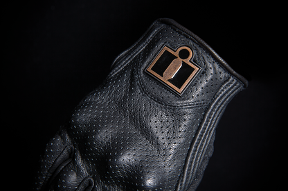 Black ICON Women's Pursuit Classic™ perforated gloves in XS size, showing breathable design and textured palm grip.