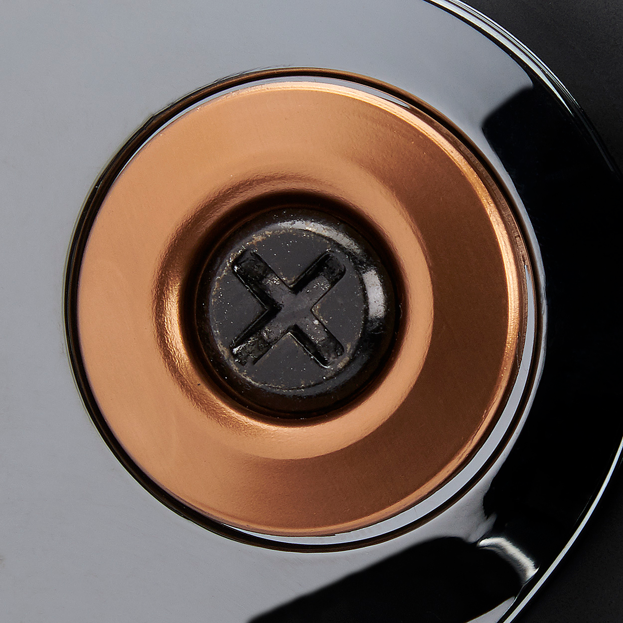 Black screw with bronze baseplate from BILTWELL Gen 2 Hardware Kit for helmets, by Bill's Exhausts.