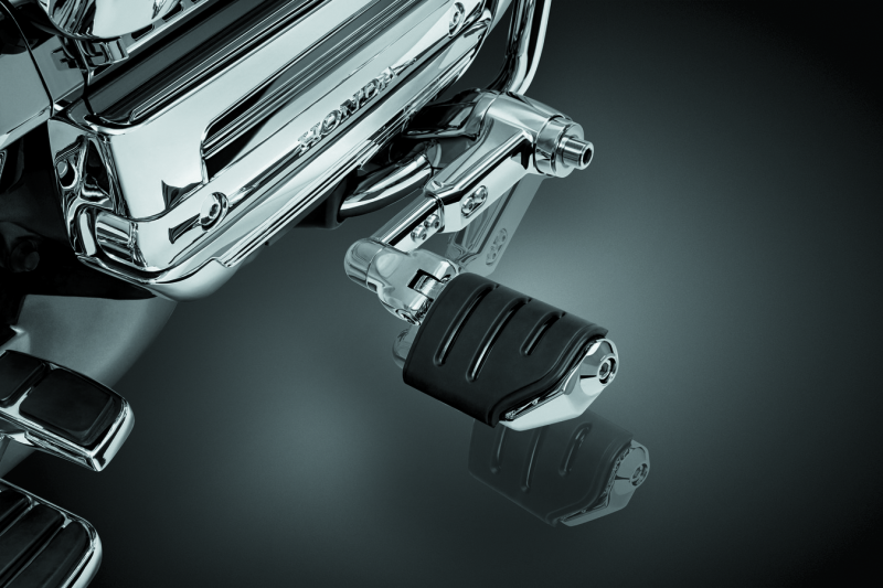 Kuryakyn Ergo III adjustable cruise mount with Trident Dually ISO pegs on a Honda Gold Wing motorcycle handlebar.