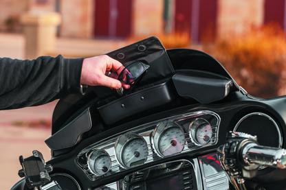 Kuryakyn Batwing fairing pouch bag mounted on a Harley Davidson 2014-2015, showing the compact storage design for motorcycle fairings.
