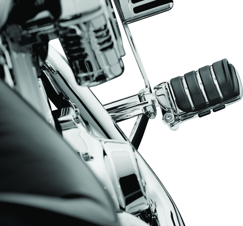 Chrome Kuryakyn Switchblade motorcycle foot pegs with male mount adapter for Harley and metric bikes, featuring sleek design and sturdy build.