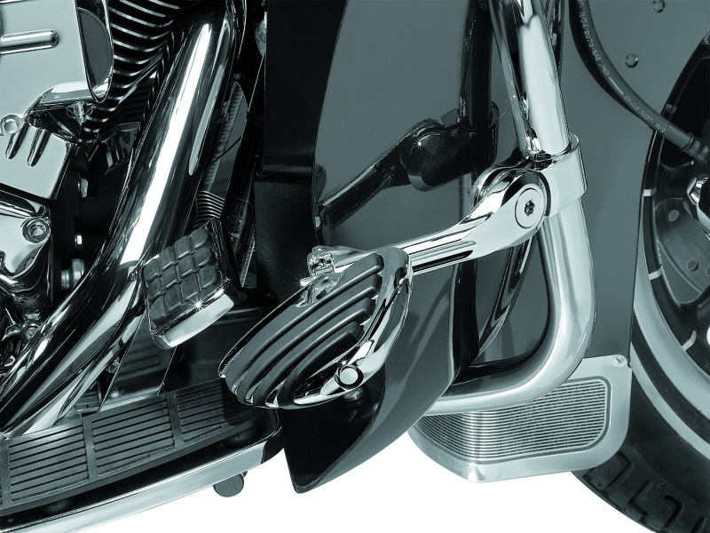 Kuryakyn Tour-Tech Cruise 6-Inch Mount Arm with ISO Wing Pegs and 1-1/4-inch chrome clamp for motorcycle cruise control.