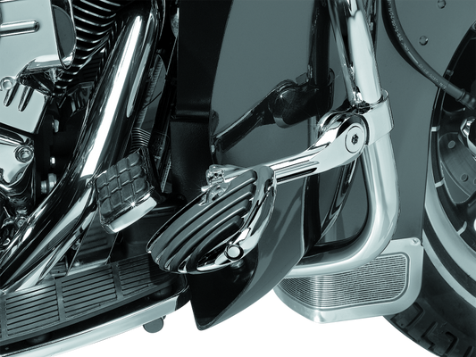 Kuryakyn Tour-Tech Cruise 6-Inch Mount Arm with ISO Wing Pegs and 1-1/4-inch chrome clamp for motorcycle cruise control.