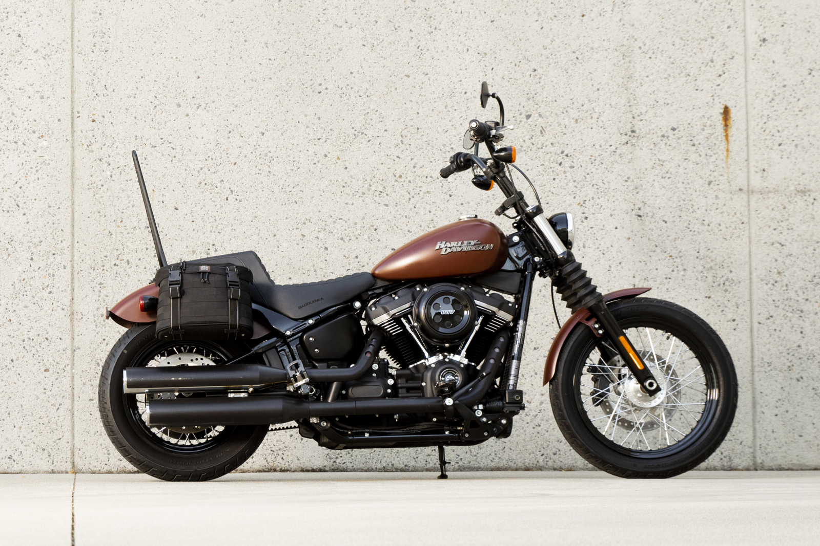 Black Biltwell Exfil-18 Saddlebags by Bill's Exhausts, showing durable leather bags with buckle closures for motorcycle storage.