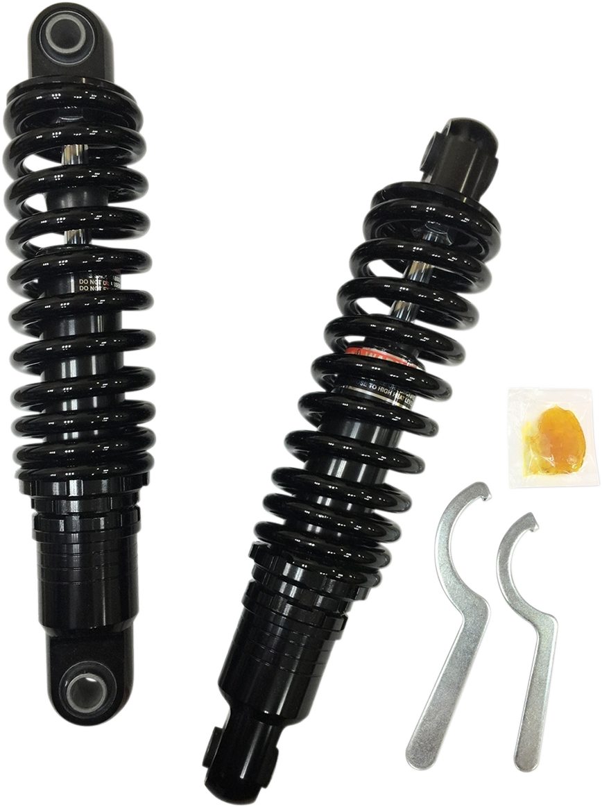 Black 12-inch Drag Specialties shocks with ride-height adjustability, heavy-duty construction for motorcycles.