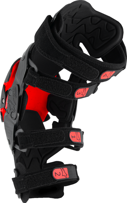 Alpinestars RK-1 Plasma knee braces in black and red with adjustable straps, size small/medium, designed for knee protection.