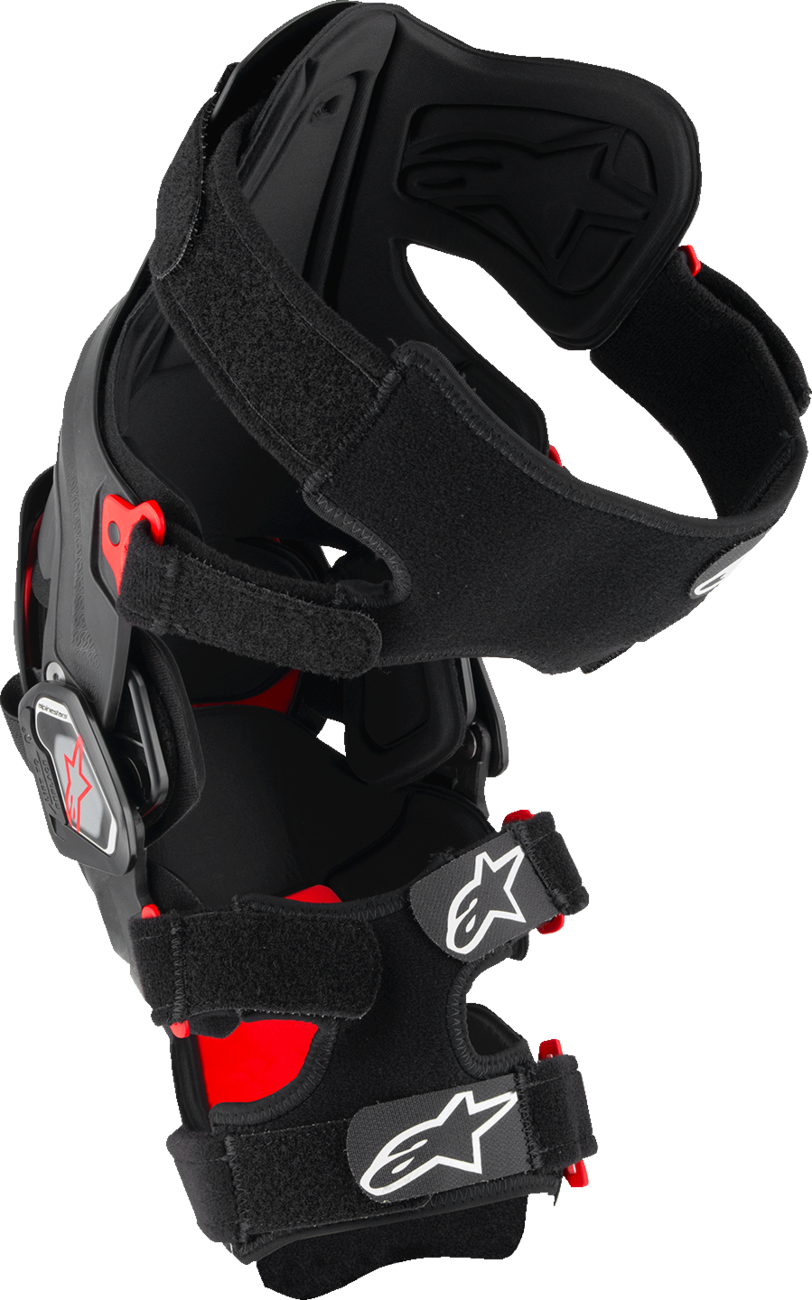 Alpinestars RK-7 Plasma knee brace in small black and red for high-performance off-road support, showing the brace's design and branding.
