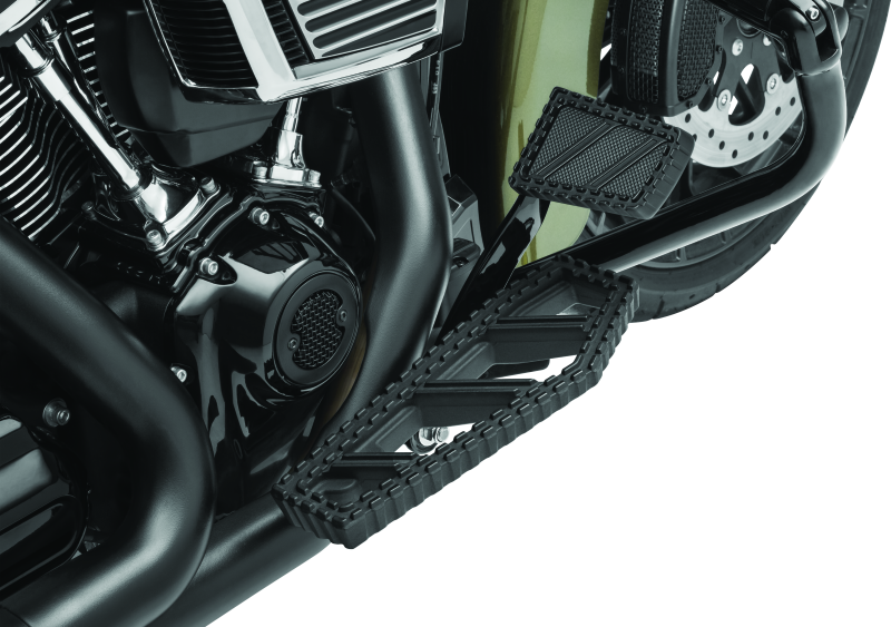 Kuryakyn Riot brake pedal pad for Harley Davidson FL models, durable aluminum with serrated traction surface.