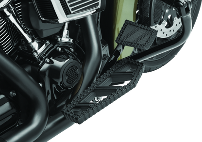 Kuryakyn Riot brake pedal pad for Harley Davidson FL models, durable aluminum with serrated traction surface.