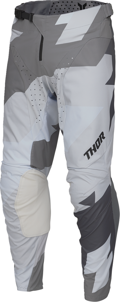 Black and gray THOR Launchmode Brave motocross pants with ventilation and durable design, US size 28, shown on a rider.
