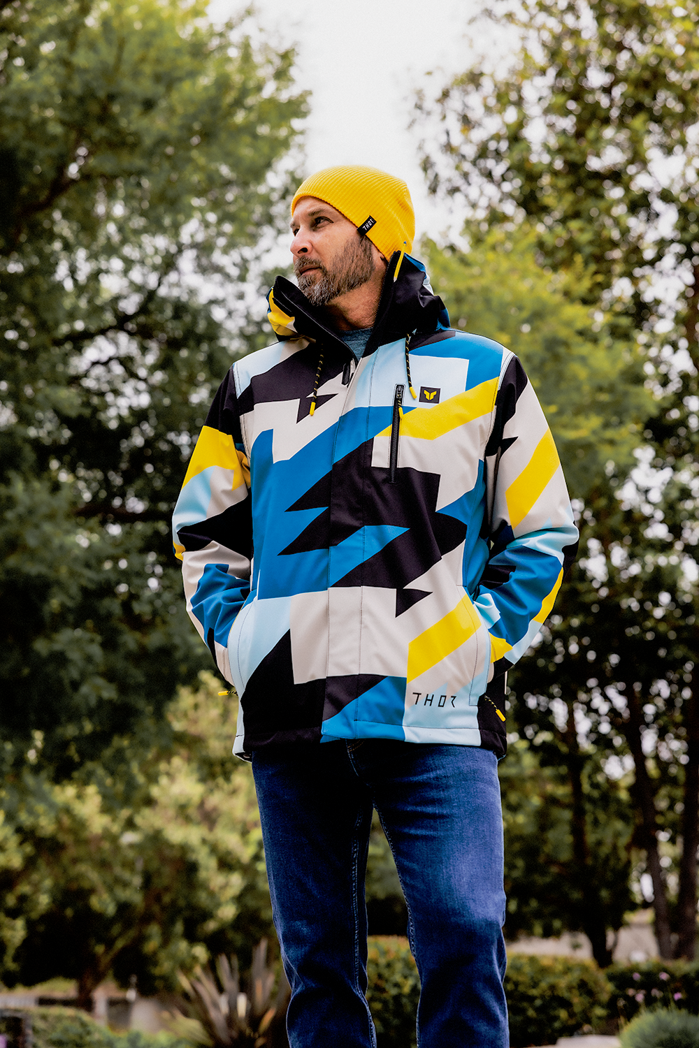 Blue and yellow THOR Brave Tour motorcycle jacket in small size, featuring protective design and bold branding details.