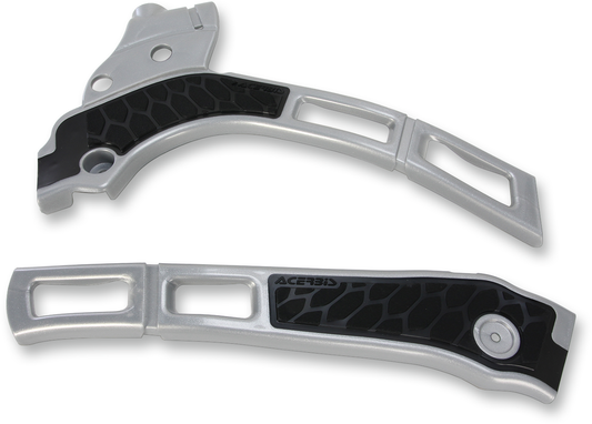 Acerbis X-Grip frame guards in silver and black installed on a motorcycle frame, providing protection and style.