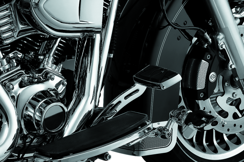 Kuryakyn extended brake pedal girder for Harley Davidson Touring 2008-2009 models, showing the chrome metal part with mounting points.