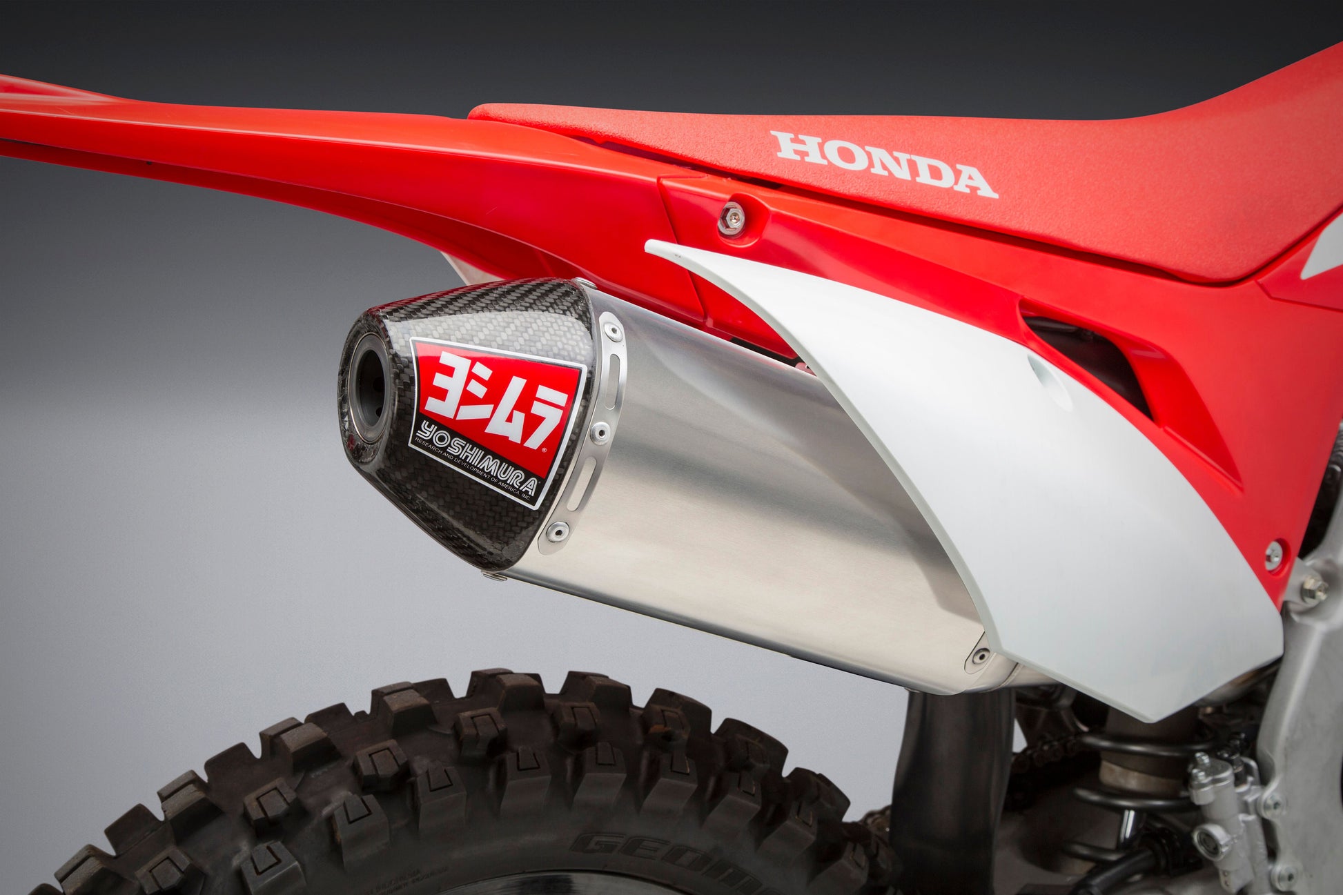 YOSHIMURA RS-4 full system exhaust with stainless steel, aluminum, and carbon fiber components for motorcycle performance.