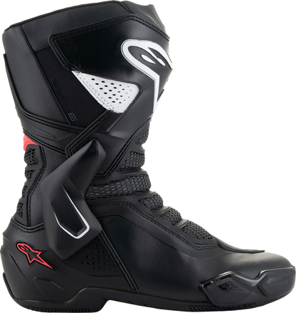 Alpinestars Stella SMX-6 V3 women's motorcycle boots in black, white, and pink with reinforced soles and ankle protection.