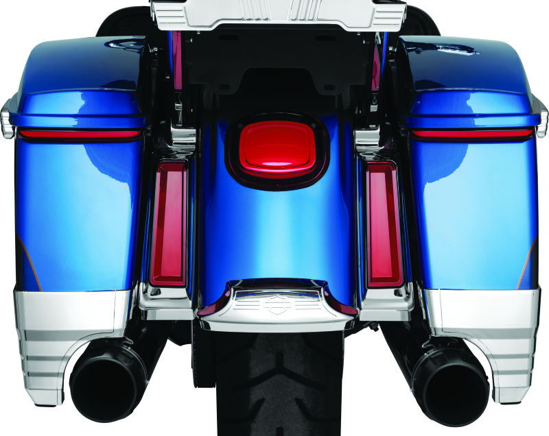 Kuryakyn Tracer Saddlebag Lights with red lens installed on a Harley Davidson Touring motorcycle for enhanced visibility and style.