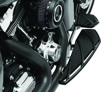Kuryakyn Phantom floorboards for Harley-Davidson in black, showing sleek design and textured surface for rider comfort.