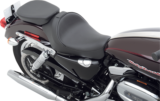 Rear solo seat for XL models by Drag Specialties, wide design with smooth finish, fits 2004-2022 Harley-Davidson motorcycles
