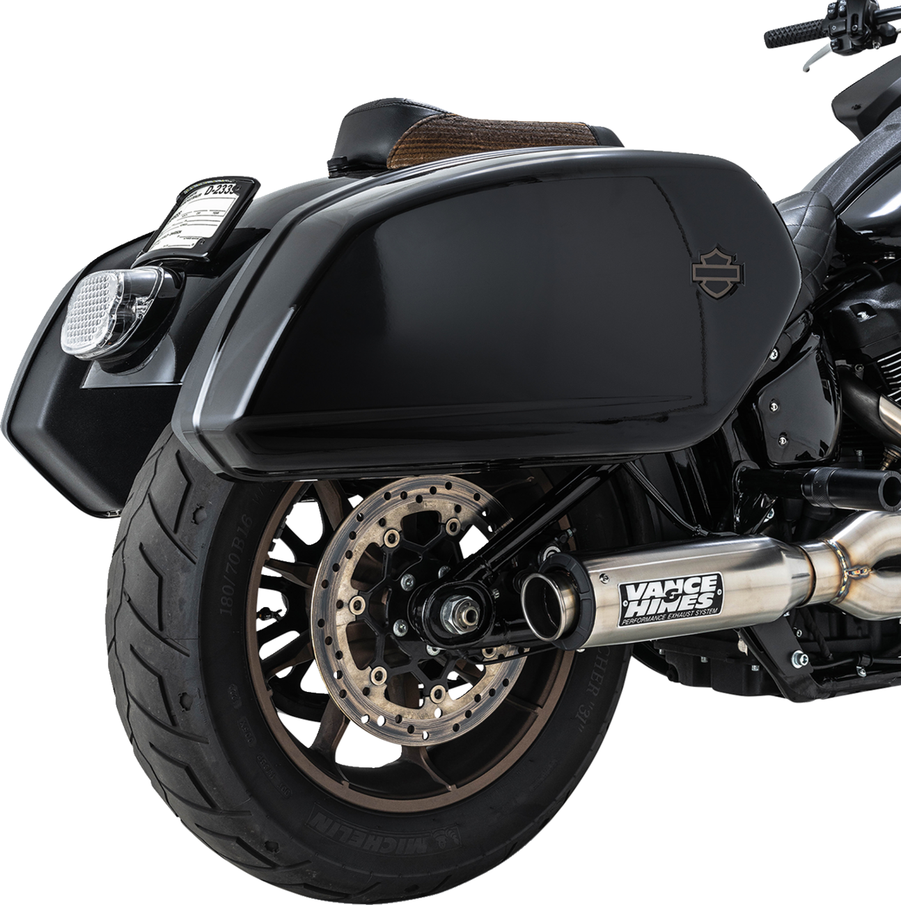VANCE & HINES Supersport 2-Into-1 motorcycle exhaust system with brushed finish for Softail motorcycles.