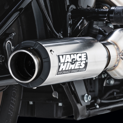 VANCE & HINES Supersport 2-Into-1 exhaust system for Softail with brushed finish, featuring sleek pipes and chrome details.
