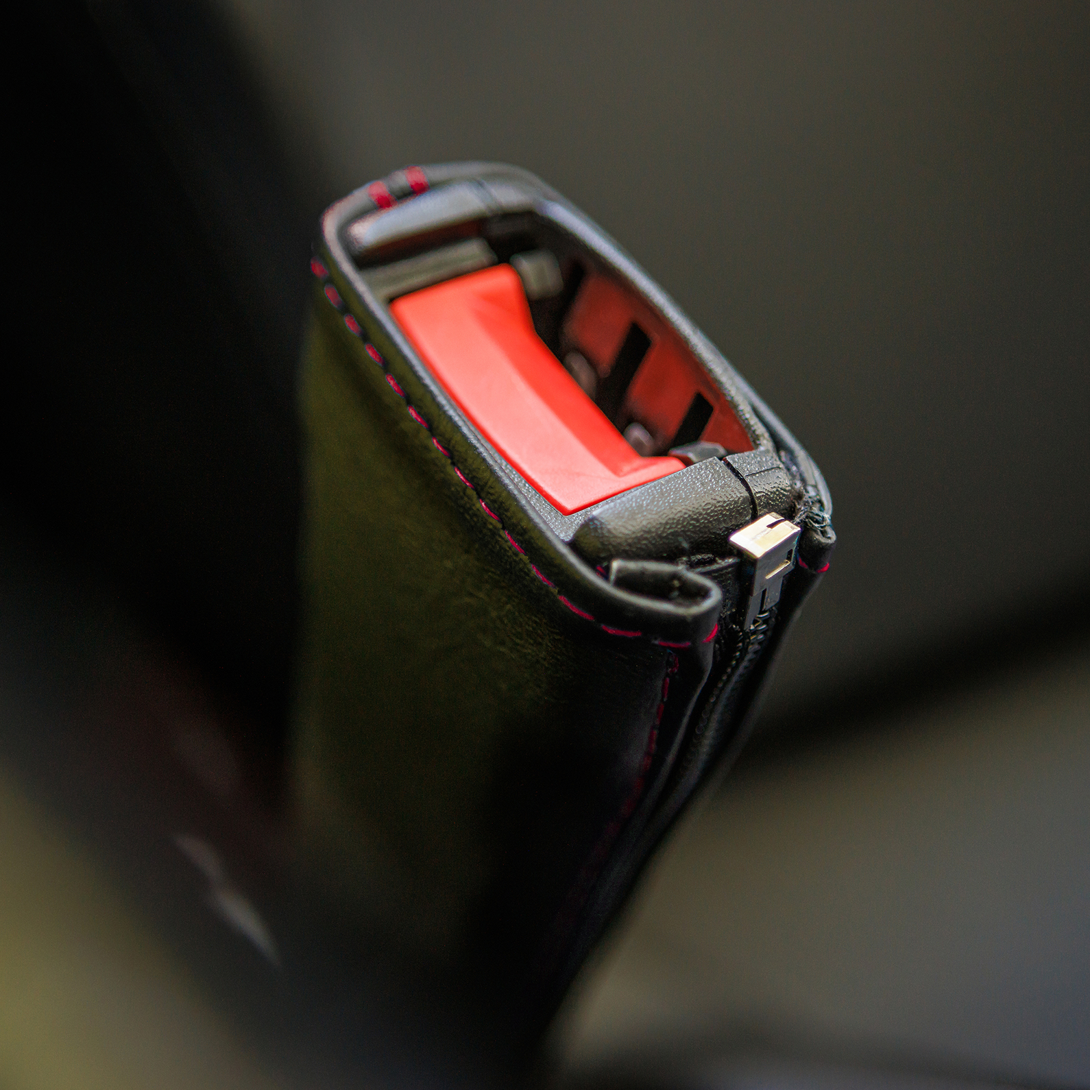 Black SHOW CHROME seat belt covers with red stitching, designed for engine safety and style, by Bill's Exhausts.