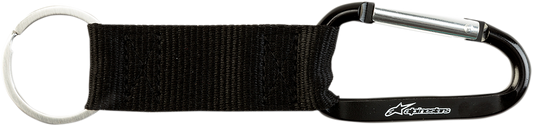 Black Alpinstars key fob with snap hook, compact and durable keychain accessory for motorcycles and gear.