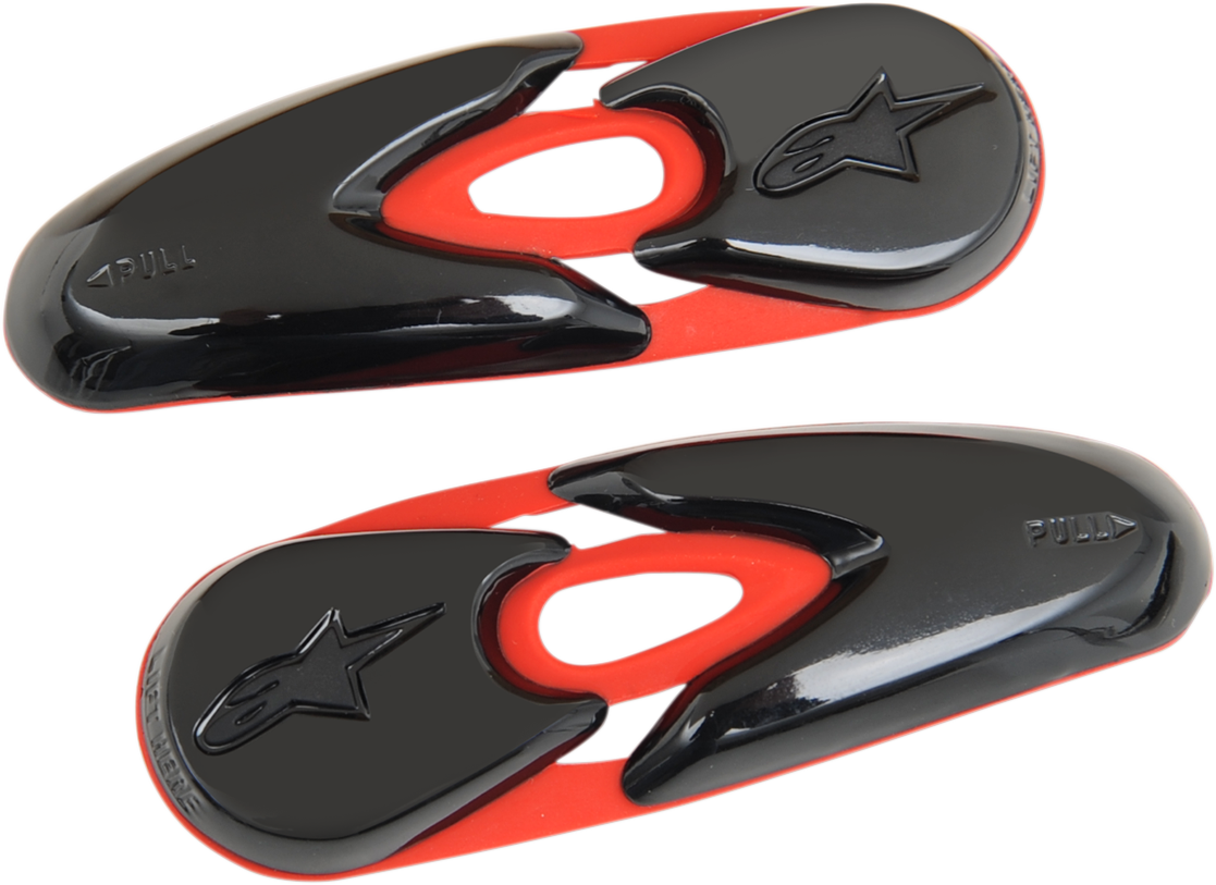 Red and black Alpinestars toe sliders for motorcycle boots, designed for durability and performance, with metal mounting points.