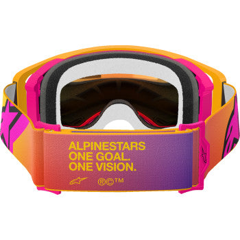 Alpinestars Supertech motorcycle goggles with yellow and pink frame, red mirror lens, and ABS vision technology.