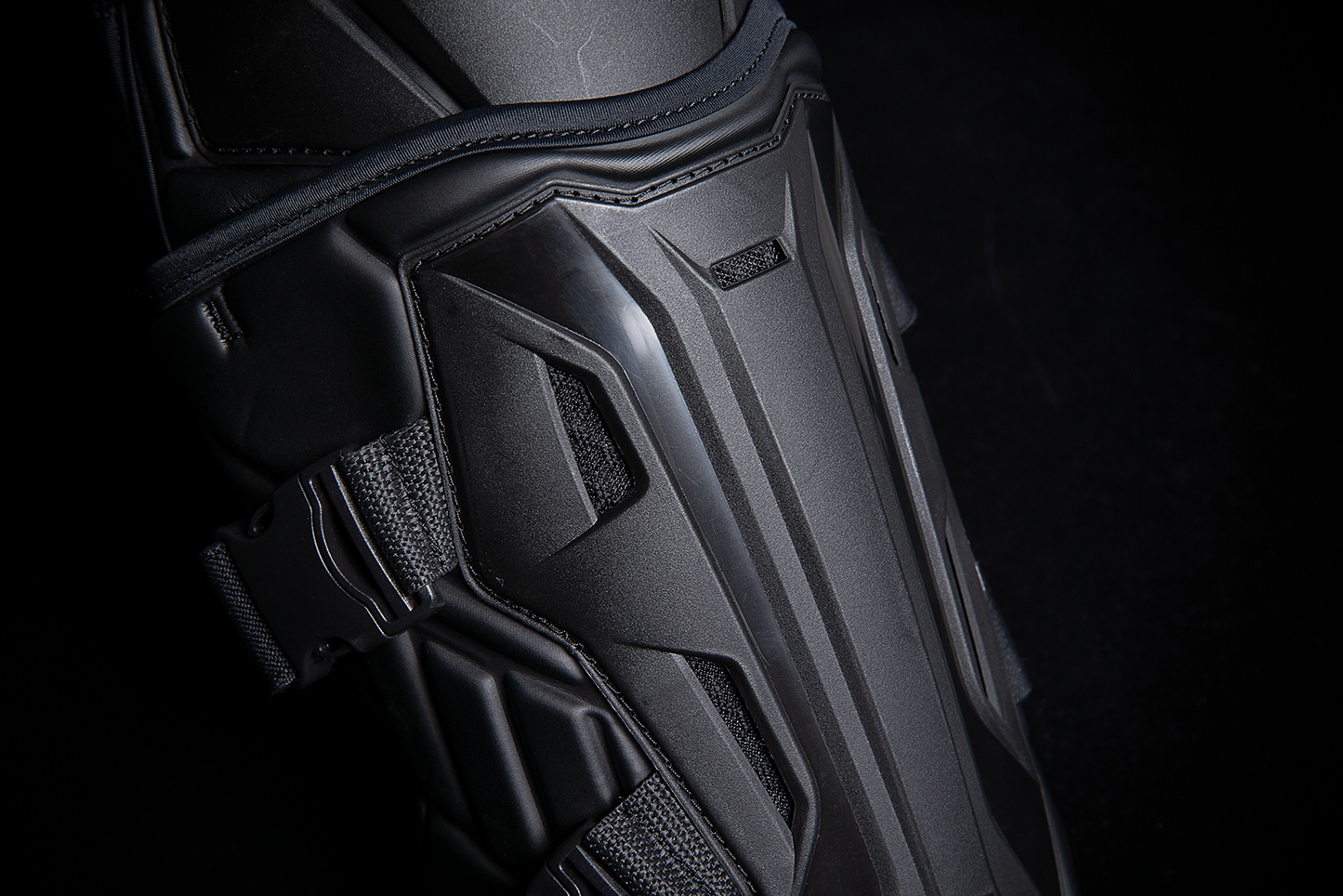 Black ICON Field Armor 3™ knee armor by Bill's Exhausts, showing padded protective gear with adjustable straps in a natural stance.