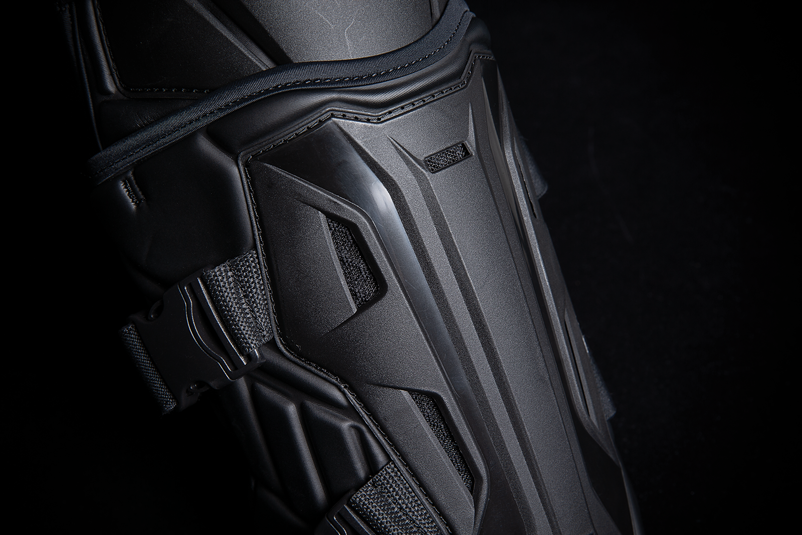Black ICON Field Armor 3™ knee armor by Bill's Exhausts, showing padded protective gear with adjustable straps in a natural stance.