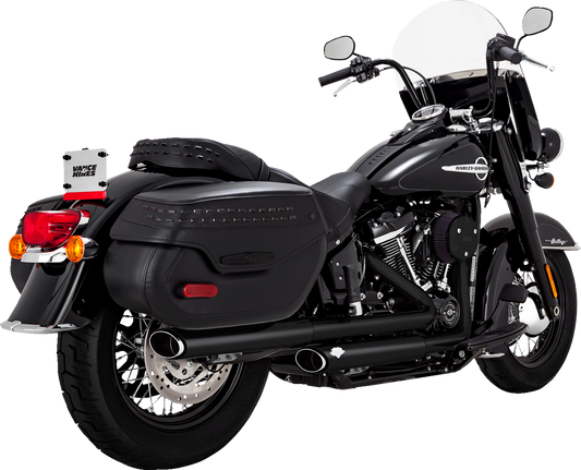 Vance & Hines Twin Slash Slip-On Mufflers with PCX™ Technology in black, paired on a motorcycle exhaust system.