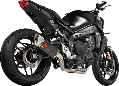 AKRAPOVIC Racing Line exhaust system for Yamaha MT-09 with carbon fiber and titanium parts, featuring sleek metal and branding.