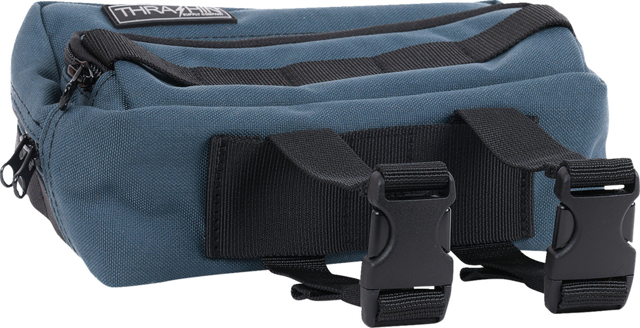Blue handlebar bag from THRASHIN SUPPLY CO., featuring a compact design with adjustable straps for bike storage.