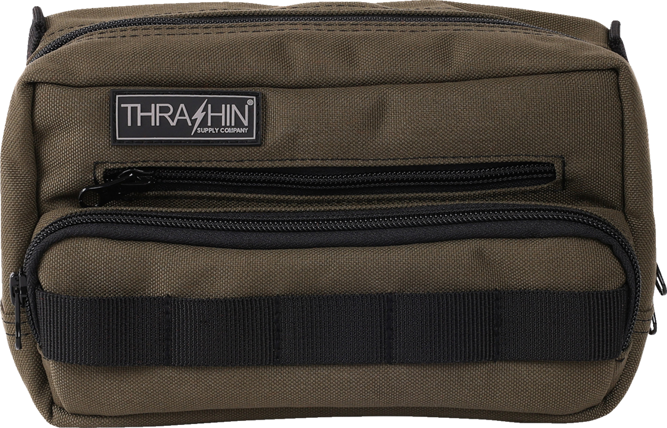 Green THRASHIN SUPPLY CO. Handlebar Bag Plus mounted on a bicycle handlebar, showcasing its compact design and durable material.