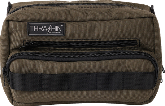 Green THRASHIN SUPPLY CO. Handlebar Bag Plus mounted on a bicycle handlebar, showcasing its compact design and durable material.