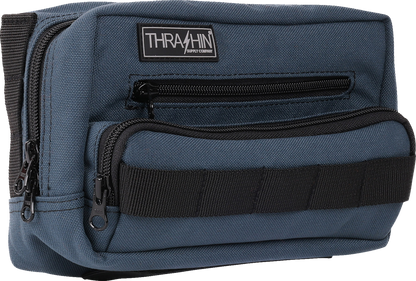 Blue THRASHIN SUPPLY CO. Handlebar Bag Plus mounted on a bicycle handlebar, showing its compact, durable design.