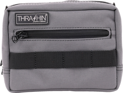 Gray handlebar bag by THRASHIN SUPPLY CO. with adjustable straps and compact design, mounted on bicycle handlebars.