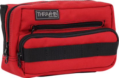 Red Thrasin Supply Co. Handlebar Bag Plus mounted on a bicycle handlebar, showcasing its compact design and secure strap system.