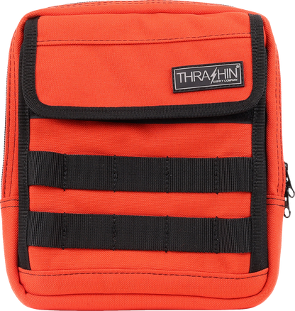 Orange THRASHIN SUPPLY CO. Handlebar Bag Slim (THB-0035) attached to a bicycle handlebar for storage.