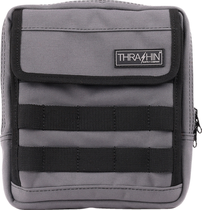 Gray THRASHIN SUPPLY CO. Handlebar Bag Slim attached to a bicycle handlebar, showcasing its compact design.
