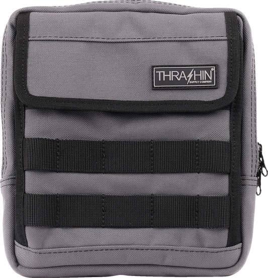 Gray THRASHIN SUPPLY CO. Handlebar Bag Slim attached to a bicycle handlebar, showcasing its compact design.