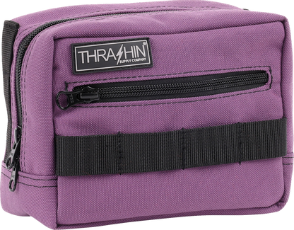 Purple handlebar bag from THRASHIN SUPPLY CO. with adjustable straps and compact design, perfect for bike storage.