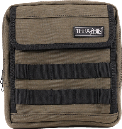 Green THRASHIN SUPPLY CO. Handlebar Bag Slim mounted on a bicycle handlebar, showcasing its compact design and adjustable straps.
